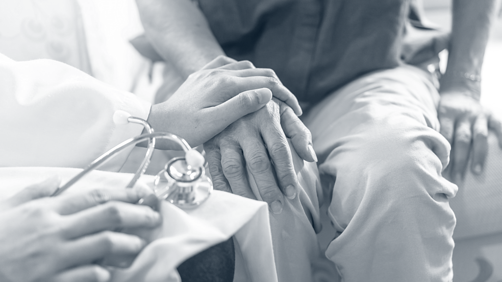 A doctor comforting a patient